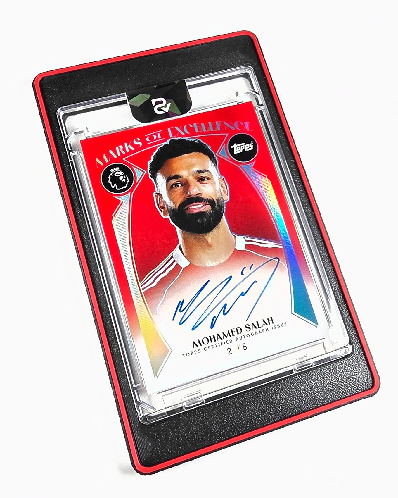 A black 3D printed mag holder with a scarlet red ring, holding a signed Mohamed Salah card, photographed flat